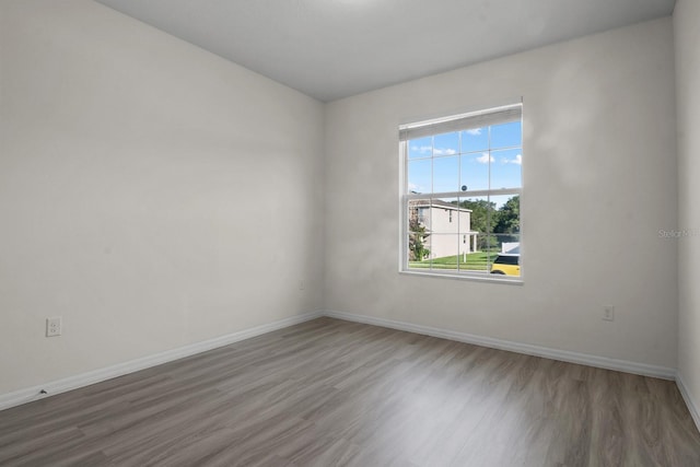 4261 SW 62nd Loop, Ocala, FL 34474 - spare room with wood finished floors and baseboards