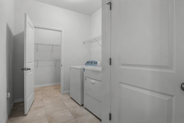 4261 SW 62nd Loop, Ocala, FL 34474 - washroom with independent washer and dryer, baseboards, and light tile patterned floors