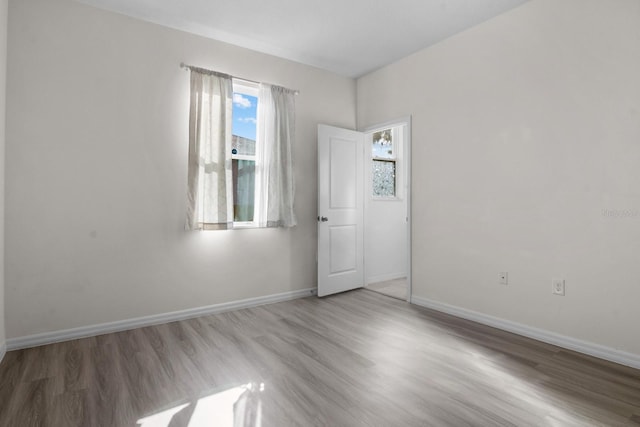 4261 SW 62nd Loop, Ocala, FL 34474 - spare room featuring baseboards and wood finished floors