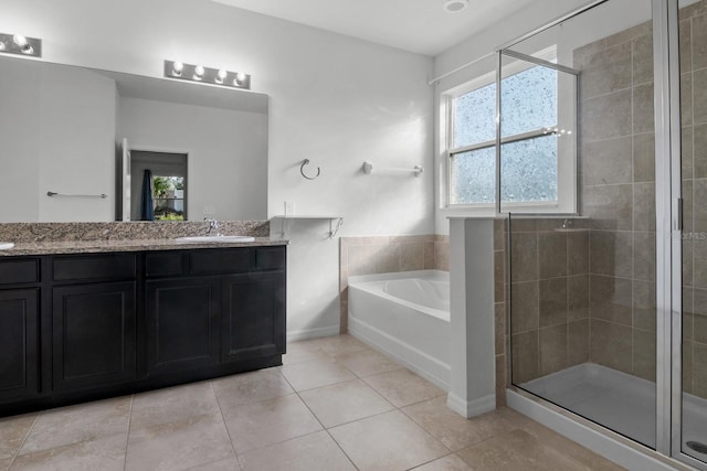 4261 SW 62nd Loop, Ocala, FL 34474 - full bath with a stall shower, a garden tub, double vanity, tile patterned floors, and baseboards