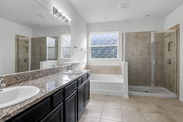 4261 SW 62nd Loop, Ocala, FL 34474 - bathroom with a stall shower, a bath, tile patterned floors, and double vanity