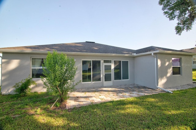 4261 SW 62nd Loop, Ocala, FL 34474 - rear view of house featuring stucco siding, a yard, and a patio