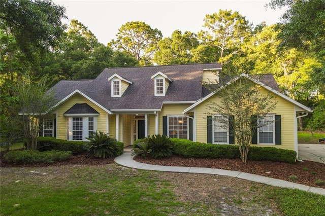 5802 SW 89th Ter, Gainesville, FL 32608 - cape cod-style house featuring roof with shingles and a front yard