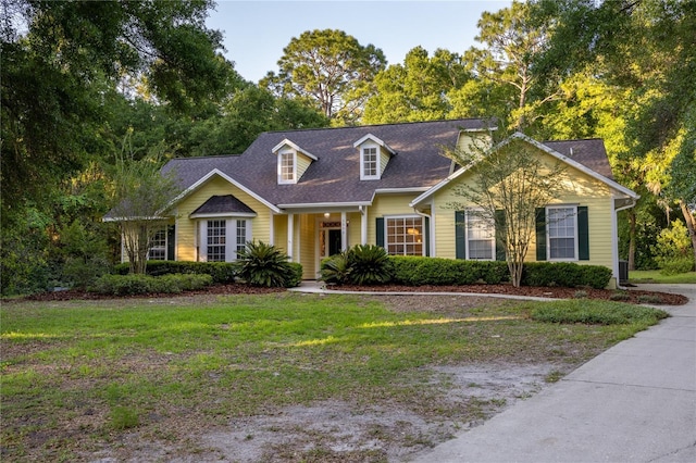 5802 SW 89th Ter, Gainesville, FL 32608 - cape cod home featuring a front yard and a shingled roof