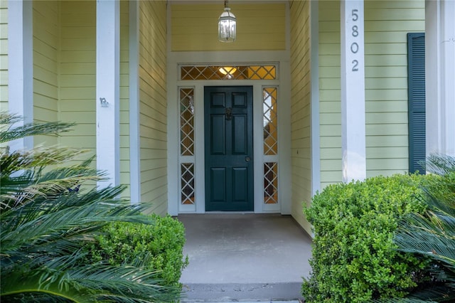 5802 SW 89th Ter, Gainesville, FL 32608 - view of exterior entry featuring a porch