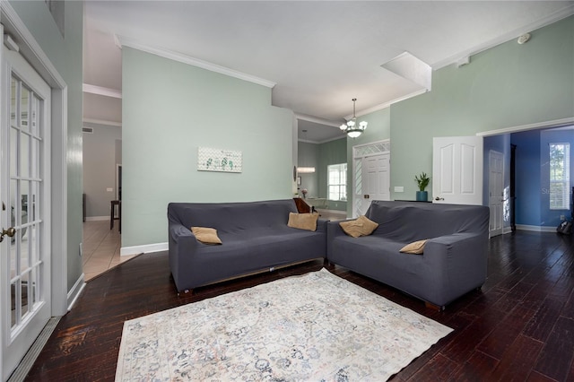 5802 SW 89th Ter, Gainesville, FL 32608 - living area featuring a chandelier, crown molding, hardwood / wood-style flooring, healthy amount of natural light, and baseboards