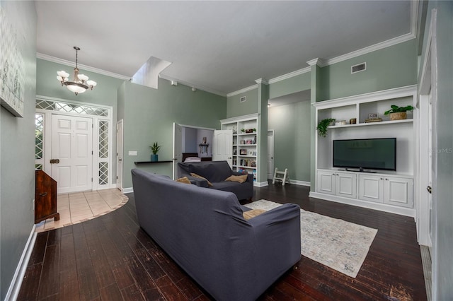 5802 SW 89th Ter, Gainesville, FL 32608 - living area with dark wood finished floors, a chandelier, ornamental molding, and baseboards