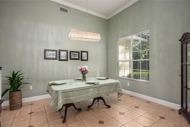 5802 SW 89th Ter, Gainesville, FL 32608 - dining room featuring ornamental molding, baseboards, light tile patterned floors, and a chandelier