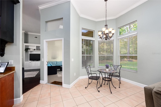 5802 SW 89th Ter, Gainesville, FL 32608 - dining room with ornamental molding, a chandelier, light tile patterned flooring, baseboards, and a towering ceiling