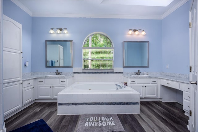 5802 SW 89th Ter, Gainesville, FL 32608 - bathroom with wood finished floors, a bath, two vanities, and ornamental molding