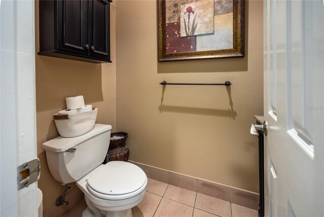 5802 SW 89th Ter, Gainesville, FL 32608 - bathroom featuring toilet, baseboards, and tile patterned flooring