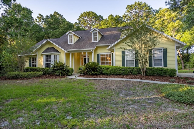 5802 SW 89th Ter, Gainesville, FL 32608 - view of front of home with a front yard and roof with shingles