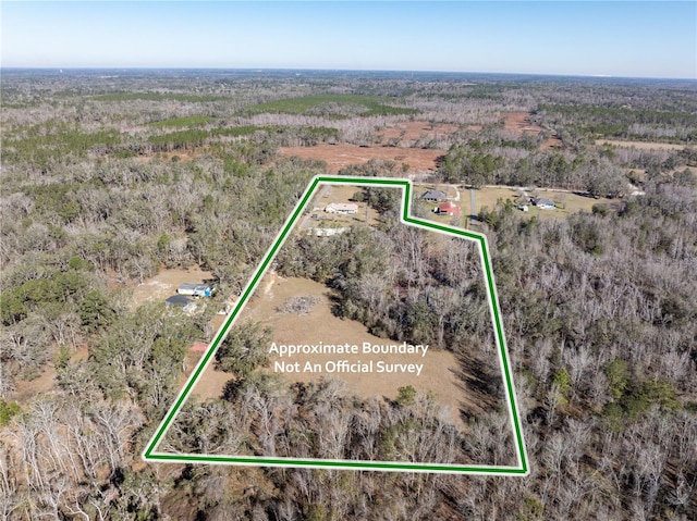 8968 122nd St, Live Oak, FL 32060 - aerial view of property and surrounding area featuring property boundaries highlighted and a heavily wooded area
