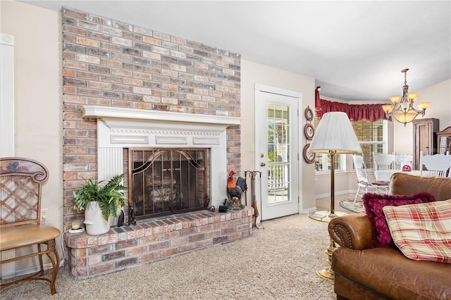 8968 122nd St, Live Oak, FL 32060 - living room with carpet flooring, a chandelier, a fireplace, and baseboards