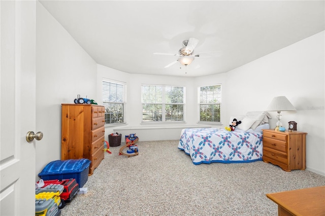8968 122nd St, Live Oak, FL 32060 - carpeted bedroom with multiple windows and ceiling fan