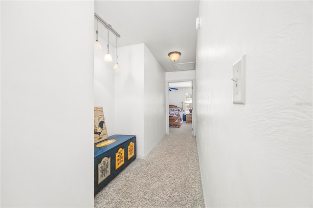 8968 122nd St, Live Oak, FL 32060 - hallway featuring attic access and carpet