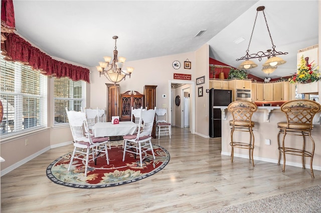 8968 122nd St, Live Oak, FL 32060 - dining space with a chandelier, light wood-style flooring, baseboards, and high vaulted ceiling