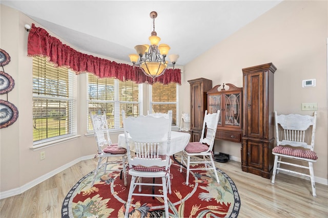 8968 122nd St, Live Oak, FL 32060 - dining room featuring a chandelier, light wood-style flooring, and baseboards