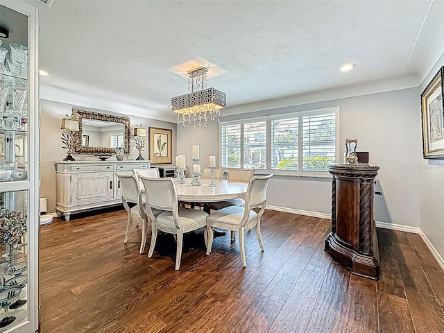 1120 81st St S, Saint Petersburg, FL 33707 - dining space featuring dark wood-style flooring, baseboards, a textured ceiling, a chandelier, and recessed lighting