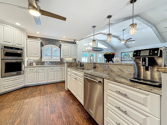 1120 81st St S, Saint Petersburg, FL 33707 - kitchen with a ceiling fan, appliances with stainless steel finishes, a sink, dark wood finished floors, and a chandelier