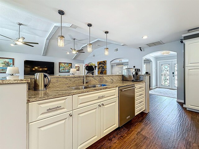1120 81st St S, Saint Petersburg, FL 33707 - kitchen with ceiling fan, dishwasher, arched walkways, a sink, and lofted ceiling