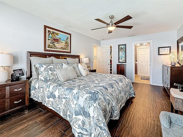 1120 81st St S, Saint Petersburg, FL 33707 - bedroom featuring dark wood-style floors, a ceiling fan, and baseboards