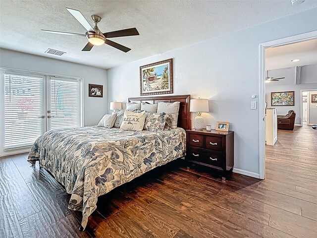 1120 81st St S, Saint Petersburg, FL 33707 - bedroom featuring hardwood / wood-style flooring, a textured ceiling, access to exterior, baseboards, and a ceiling fan