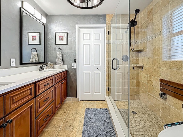 1120 81st St S, Saint Petersburg, FL 33707 - bathroom featuring a stall shower and double vanity