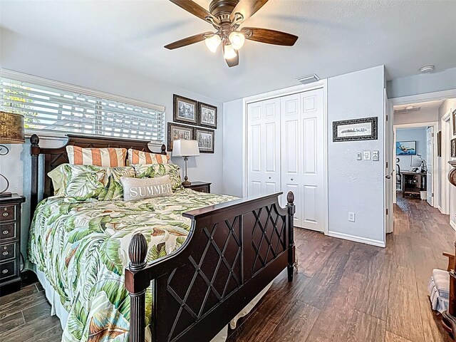 1120 81st St S, Saint Petersburg, FL 33707 - bedroom featuring dark wood-style floors, a closet, and a ceiling fan