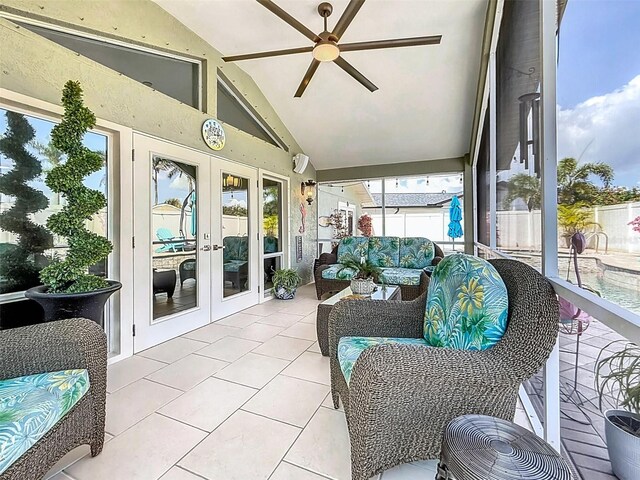 1120 81st St S, Saint Petersburg, FL 33707 - sunroom featuring french doors, ceiling fan, vaulted ceiling, and an outdoor hangout area