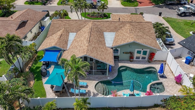 1120 81st St S, Saint Petersburg, FL 33707 - view of pool with a fenced backyard, french doors, a patio, and a pool with connected hot tub