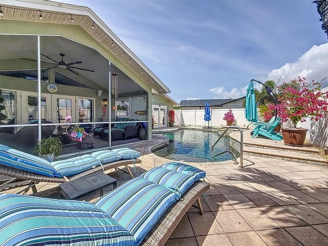 1120 81st St S, Saint Petersburg, FL 33707 - view of swimming pool featuring a patio, ceiling fan, fence, and french doors