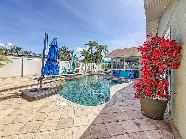 1120 81st St S, Saint Petersburg, FL 33707 - view of pool featuring a patio, a fenced backyard, and an outdoor hot tub