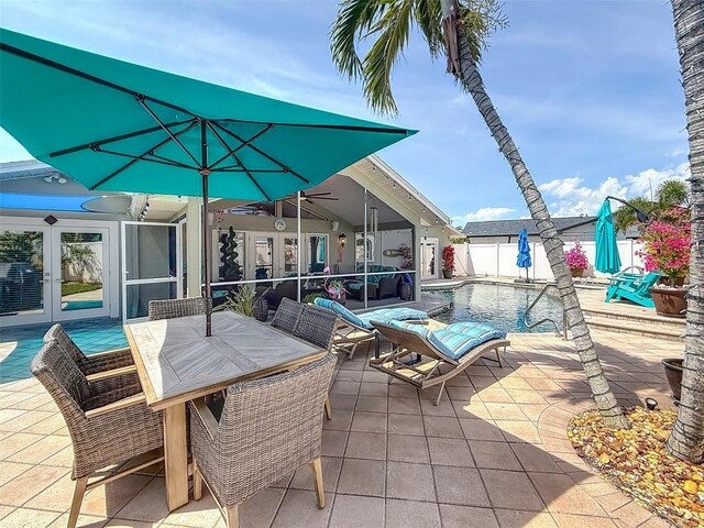 1120 81st St S, Saint Petersburg, FL 33707 - view of patio featuring french doors and fence