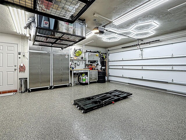 1120 81st St S, Saint Petersburg, FL 33707 - garage featuring a garage door opener