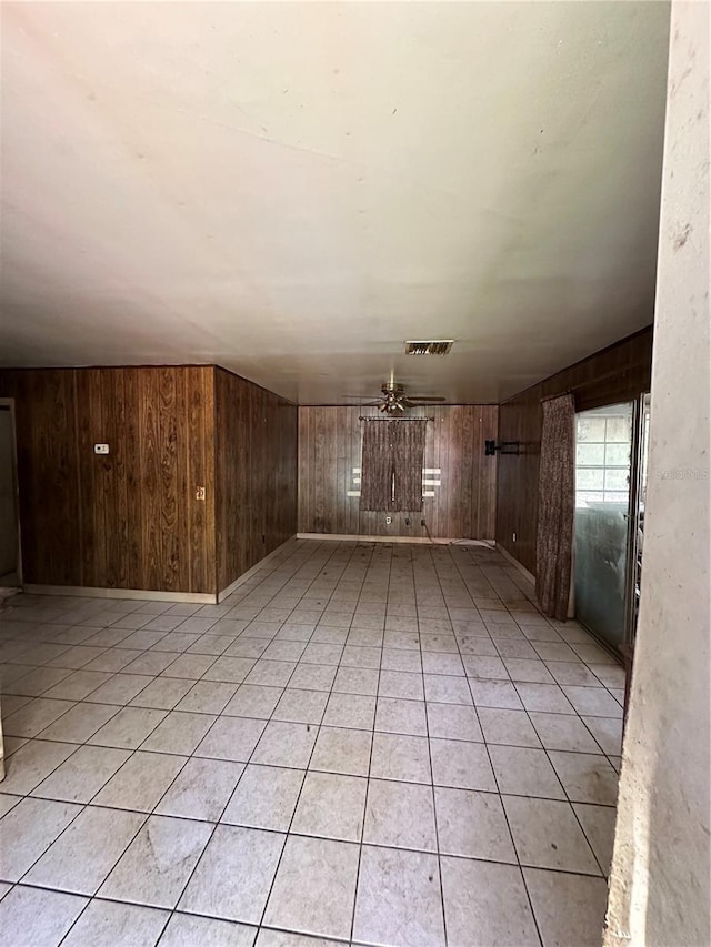 15750 NE 150th Ter, Fort Mc Coy, FL 32134 - unfurnished living room featuring wooden walls and light tile patterned floors