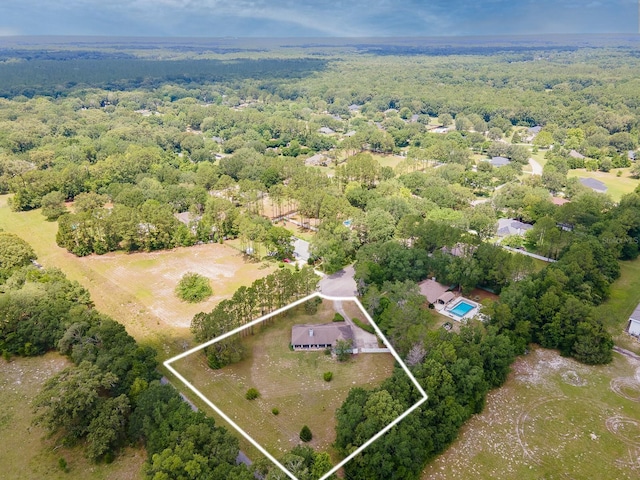3233 SW 125th St, Archer, FL 32618 - aerial overview of property's location featuring property boundaries highlighted and a heavily wooded area