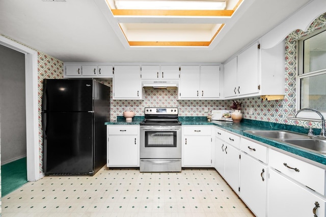 3233 SW 125th St, Archer, FL 32618 - kitchen featuring freestanding refrigerator, stainless steel range with electric cooktop, under cabinet range hood, a sink, and white cabinets