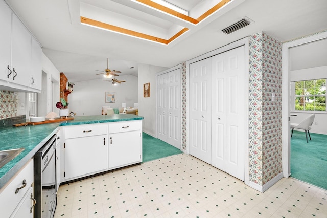 3233 SW 125th St, Archer, FL 32618 - kitchen featuring white cabinets, a peninsula, dishwashing machine, ceiling fan, and light floors