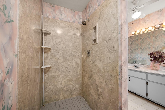3233 SW 125th St, Archer, FL 32618 - bathroom featuring tile patterned flooring, tiled shower, and vanity