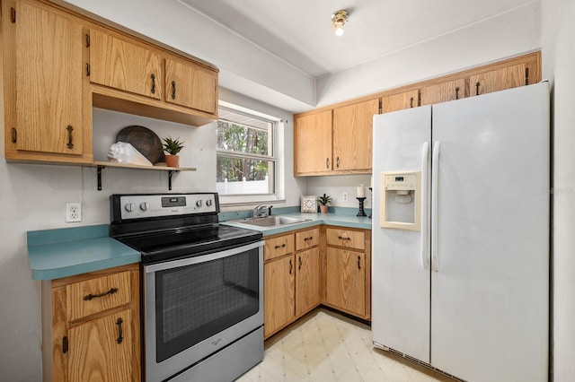 3233 SW 125th St, Archer, FL 32618 - kitchen featuring white fridge with ice dispenser, stainless steel range with electric cooktop, light flooring, open shelves, and a sink