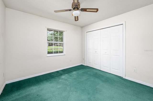 3233 SW 125th St, Archer, FL 32618 - unfurnished bedroom with carpet flooring, baseboards, a closet, and a ceiling fan