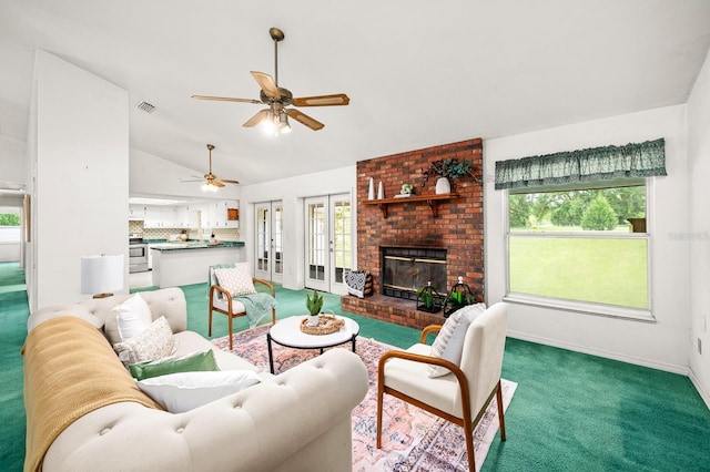 3233 SW 125th St, Archer, FL 32618 - living room with lofted ceiling, carpet flooring, a ceiling fan, a brick fireplace, and baseboards