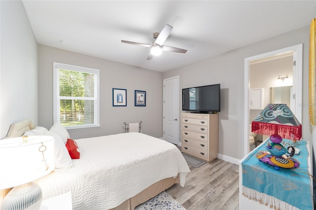 bedroom featuring light wood-style floors, ceiling fan, and baseboards