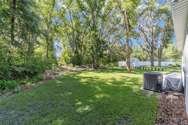 view of yard with central AC
