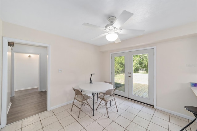 13207 SW Williston Rd, Micanopy, FL 32667 - dining room featuring french doors, light tile patterned flooring, baseboards, and ceiling fan
