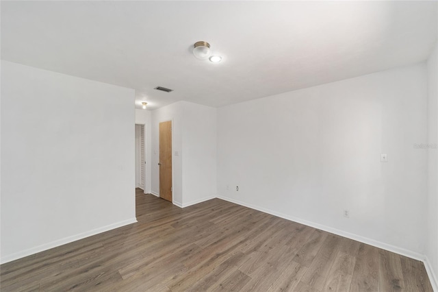 13207 SW Williston Rd, Micanopy, FL 32667 - spare room featuring wood finished floors and baseboards