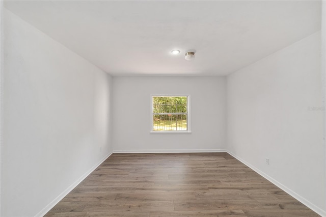13207 SW Williston Rd, Micanopy, FL 32667 - spare room featuring wood finished floors and baseboards