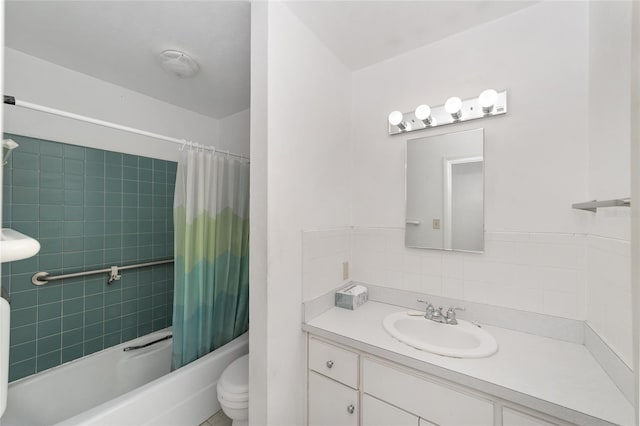 13207 SW Williston Rd, Micanopy, FL 32667 - bathroom featuring toilet, shower / bath combo, tasteful backsplash, and vanity