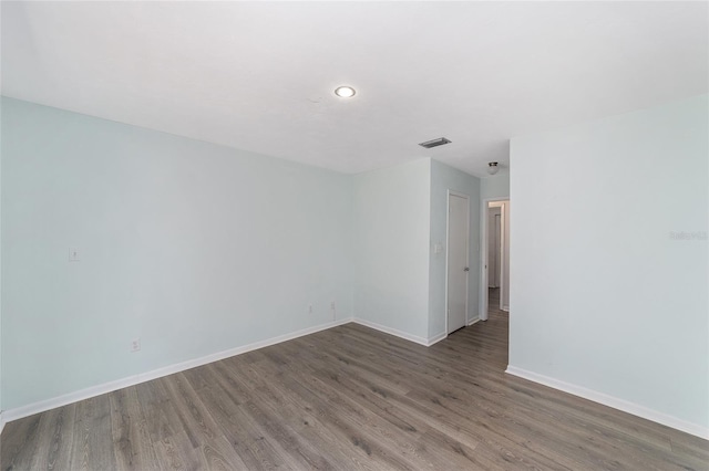 13207 SW Williston Rd, Micanopy, FL 32667 - unfurnished room with baseboards, wood finished floors, and recessed lighting